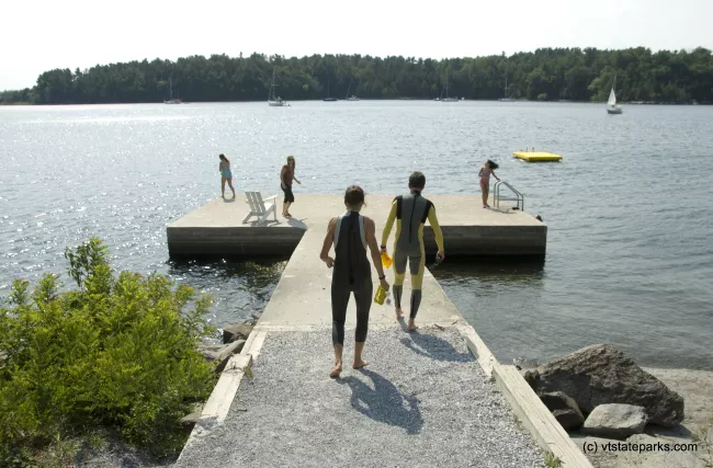 Bill Eichorn and Lisa Bernardin of Middlebury, Vermont, suit up for a swim at Kingsland Bay Stata Park. Photo by Karen Pike
