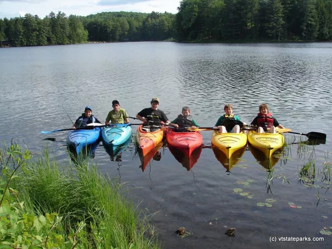 A rainbow of kayaks at Half Moon Pond State Park by Lisa Ann Munukka Frasier
