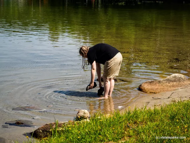 Rinsing off my shoes at Maidstone State Park by Kristy Will;ey