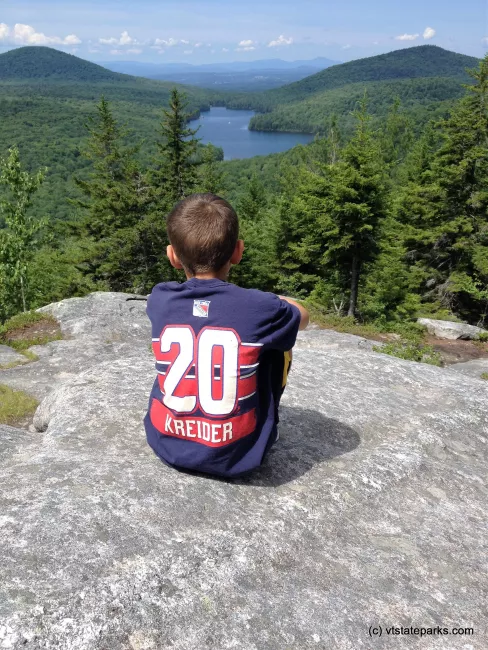 Sitting at the summit of Owl's Head at New Discovery State Park