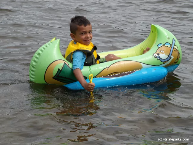 Cute kid on a Floatie at Elmore State Park by Matt Parsons