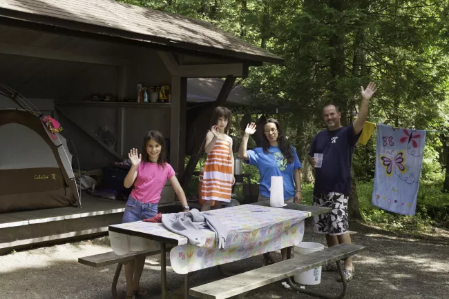 Happy family at Lake Carmi State Park by Heather Sefcik