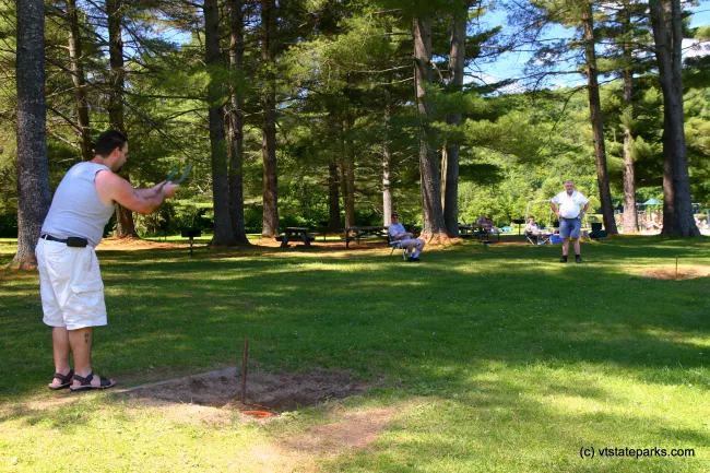 Playing horseshoes at Camp Plymouth State Park by Jared Clark