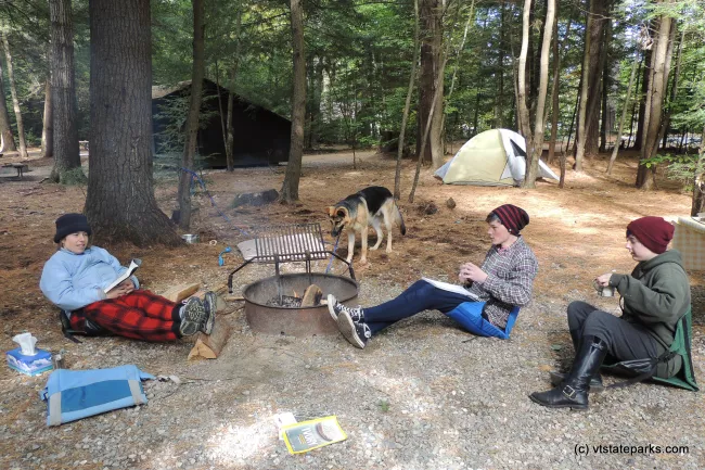 Relaxing by reading and drinking hot chocolate at Quechee State Park by Tara Schatz