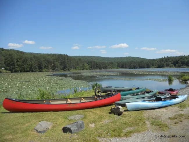 Boats at Dewey's Pond at Quechee State Park by Paul Carney