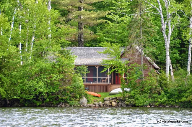 Perry Merrill cottage from the water at Ricker Pond State Park by Linda Carlsen Sperry