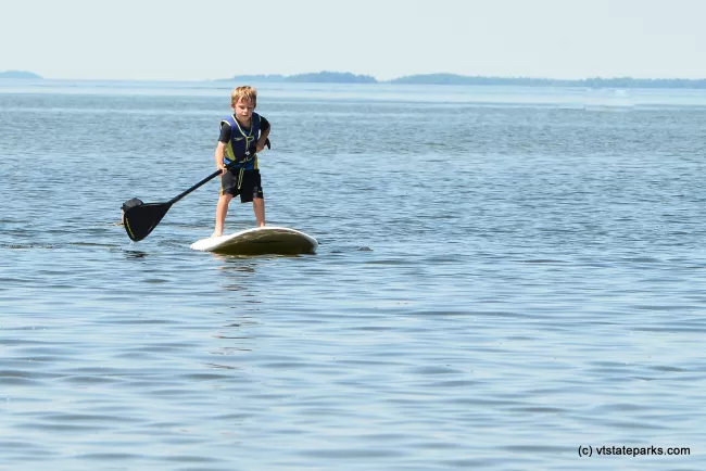 This little guy is during an amazing job paddle boarding at Sandbar State Park by Raven Schwan-Noble