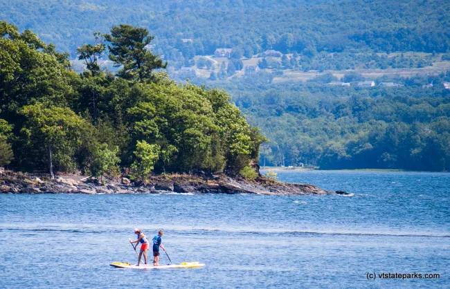 Stand up paddle boarding on beautiful Lake Champlain at Burton Island State Park by Tara Schatz