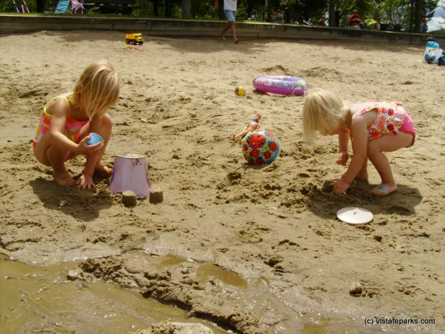 Playing in the sand at Boulder Beach State Park by Michelle Boucher