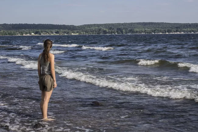 Wading in Lake Champlain at Kamp Kill Kare State Park by Kristen Jensen