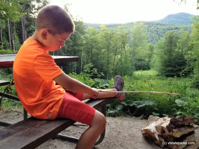 Whittling a roasting stick at his campsite at Coolidge State Park