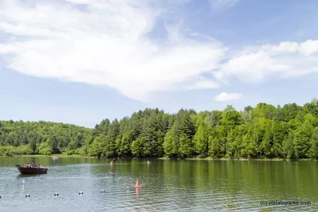 Boating away from the beach area at Waterbury Center State Park by Karalyn Mark