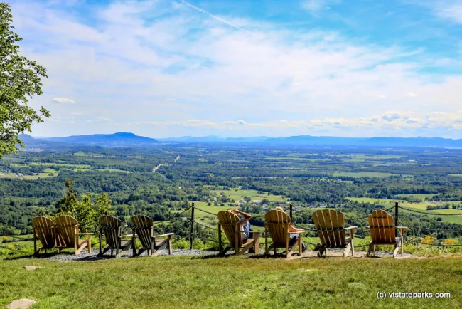 People relaxing at the top of Mt Philo State Park by Bob Ricketson