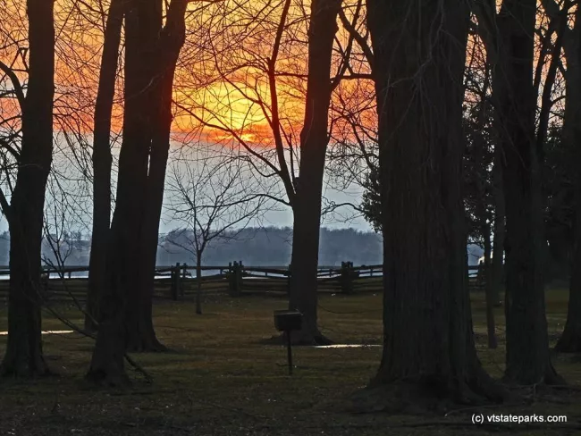 A spring sunset at Sand Bar State Park by Tina Greco Valentinetti.