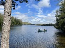 Staff ride in the newly donated cargo canoe at Green River Reservoir.